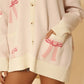 All over bow knit cardigan